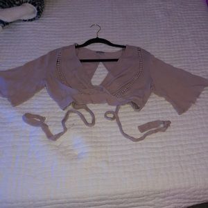 A light purple color crop top with short sleeves